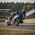 A MotoGP rider leans their motorcycle through a fast corner at the Brno circuit during the Czechia Grand Prix.