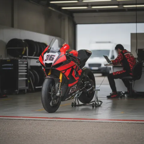 Joan Mir's Honda race bike sits on a stand in the pit garage after his early retirement from the San Marino Grand Prix.