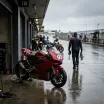 Illustration for our Australian GP qualifying story: a racing bike resting in a wet pit garage.