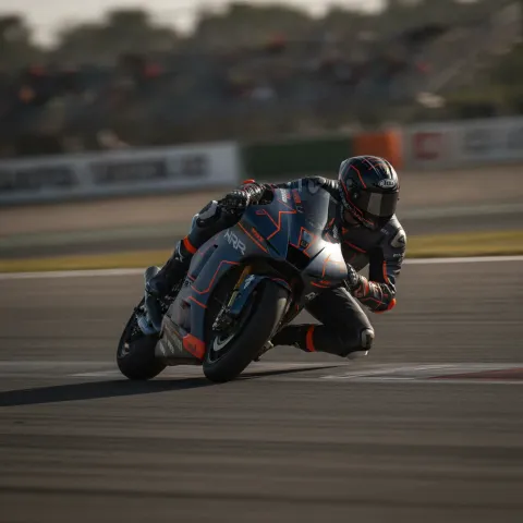 Marc Marquez celebrates his victory on his motorcycle after finishing the German Grand Prix.